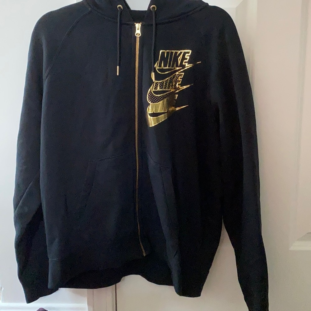 Black and gold Nike sweatshirt. size medium